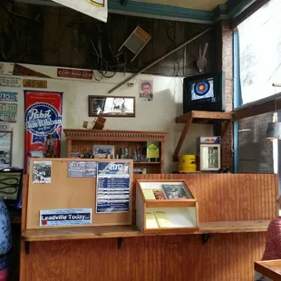 a man and a woman sitting at a bar