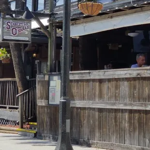 Front side with patio and live musician.