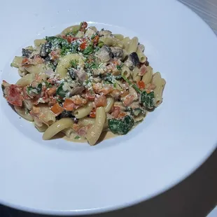a pasta dish on a white plate