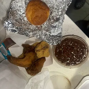 Fried chicken wing and snapper, red beans, and rice