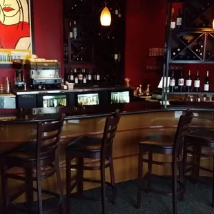 bar with wine bottles on shelves
