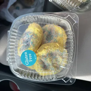 three donuts in a plastic container