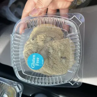 a hand holding a cookie