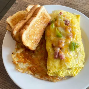 Denver Omelet, generous on the fillings, with hash browns