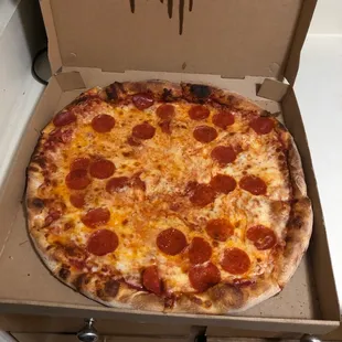 a pepperoni pizza in a box