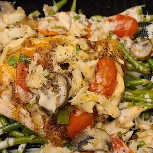 Chilean sea bass with crabmeat topping over green beans.