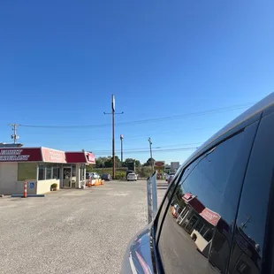 a car parked in front of a restaurant