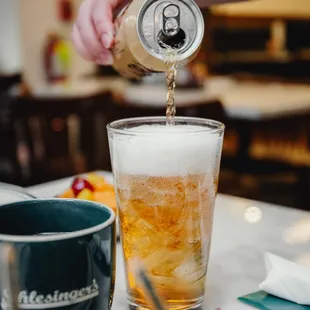 a beer being poured into a glass