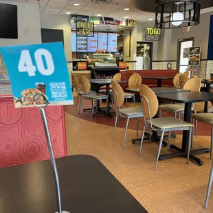 a restaurant with tables and chairs