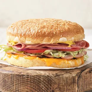 a sandwich on a wooden board