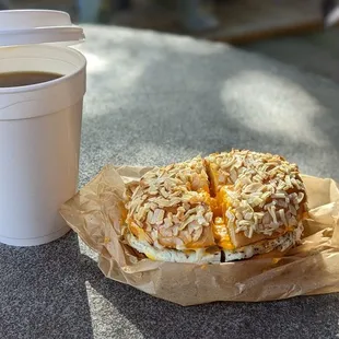 a cup of coffee and a sandwich