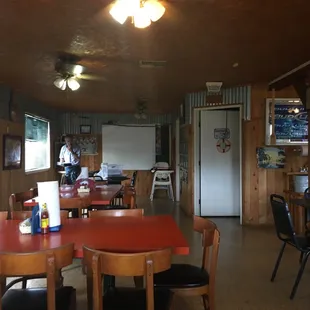 a dining room with tables and chairs