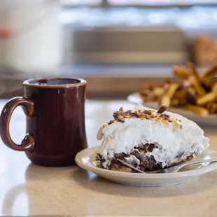 a plate of food and a cup of coffee