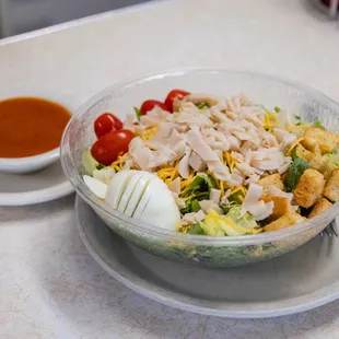 a bowl of salad with dressing