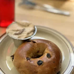 Raisin and cinnamon bagel with strawberry smear.