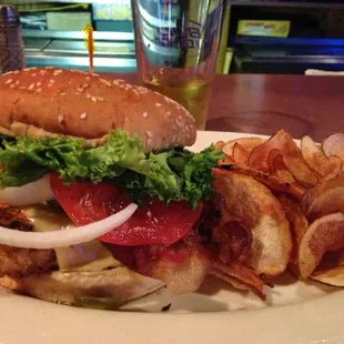 Blackened Grilled Chicken sandwich with everything and a side of homemade chips.
