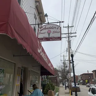 two people walking down the sidewalk