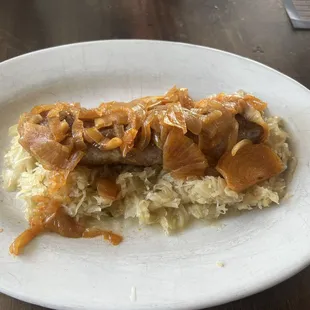 Brat with onions and sauerkraut. Yep homemade brat very tasty.