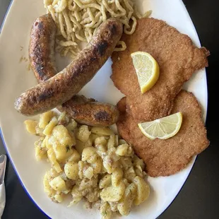 Sampler plate schnitzel, bratwurst,German potato salad,spetzle