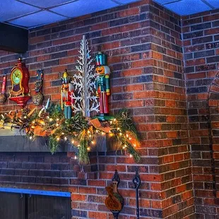 a brick wall with christmas decorations