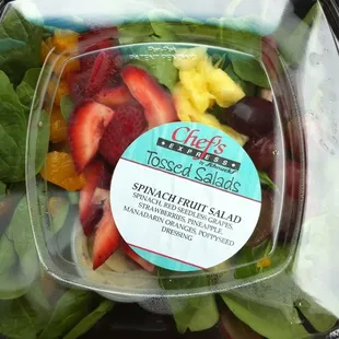 a salad in a plastic container