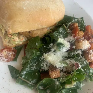 Daily special crab and lobster cake sandwich, with Caesar salad.