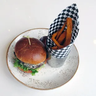 Schokko burger and fries with Ohio beef, housemade pickles, cheddar, red onion, &amp; schokko sauce