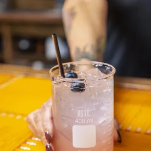 a person holding a drink