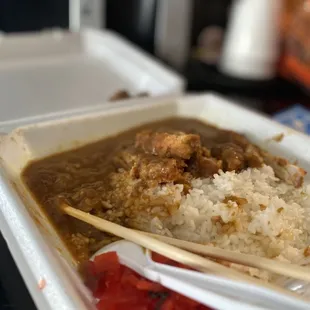 a close up of a meal in a styrofoam container