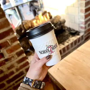 sipping a cozy latte by the fire