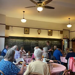 a group of people sitting at tables