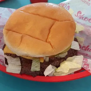 THEIR FAMOUS TRIPLE BEEF BURGER WHICH IS JUICY INSIDE BUT CRISPY IN THE TIP OF THE BURGER PATTY