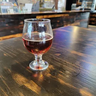 a glass of wine on a table