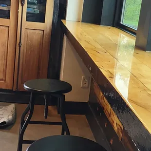 Low height stools @ the bar in front of a garage door