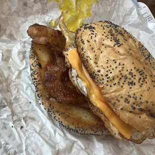 Bacon egg and cheese on a poppyseed roll