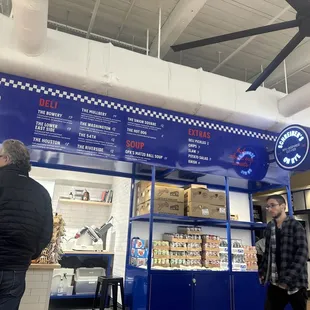 a man standing in front of a store