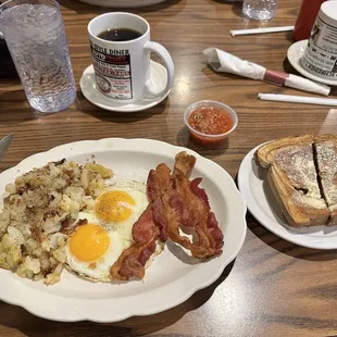 Two eggs, bacon, rye toast and American fries