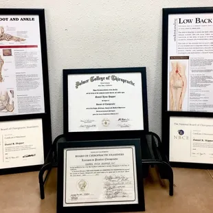 Educational materials, framed licenses, and diplomas. Both doctors are proud graduates of sports based Palmer West San Jose campus.