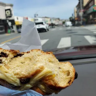 Inside, raisins and other ingtedients. Outside custard cross