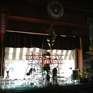 a man standing behind a bar