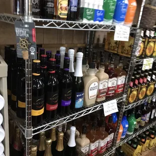 a shelf full of bottles of wine