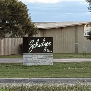 a sign in front of a building