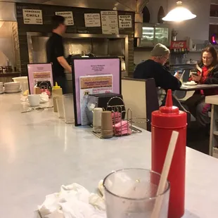 a glass of soda on a counter