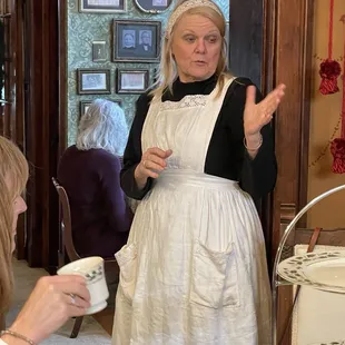 The mansion's owner telling guests stories about the history of the Schuster Mansion.