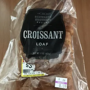 a loaf of bread wrapped in plastic