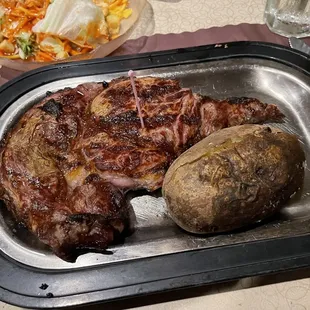 Rib eye and baked potato