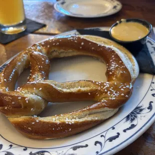 Warm salty pretzel with beer cheese.