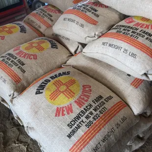 a pile of bags of grain