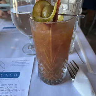 two glasses of water and a drink