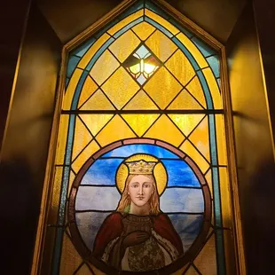 Stained glass window. You can also see some of the original stone exposed.